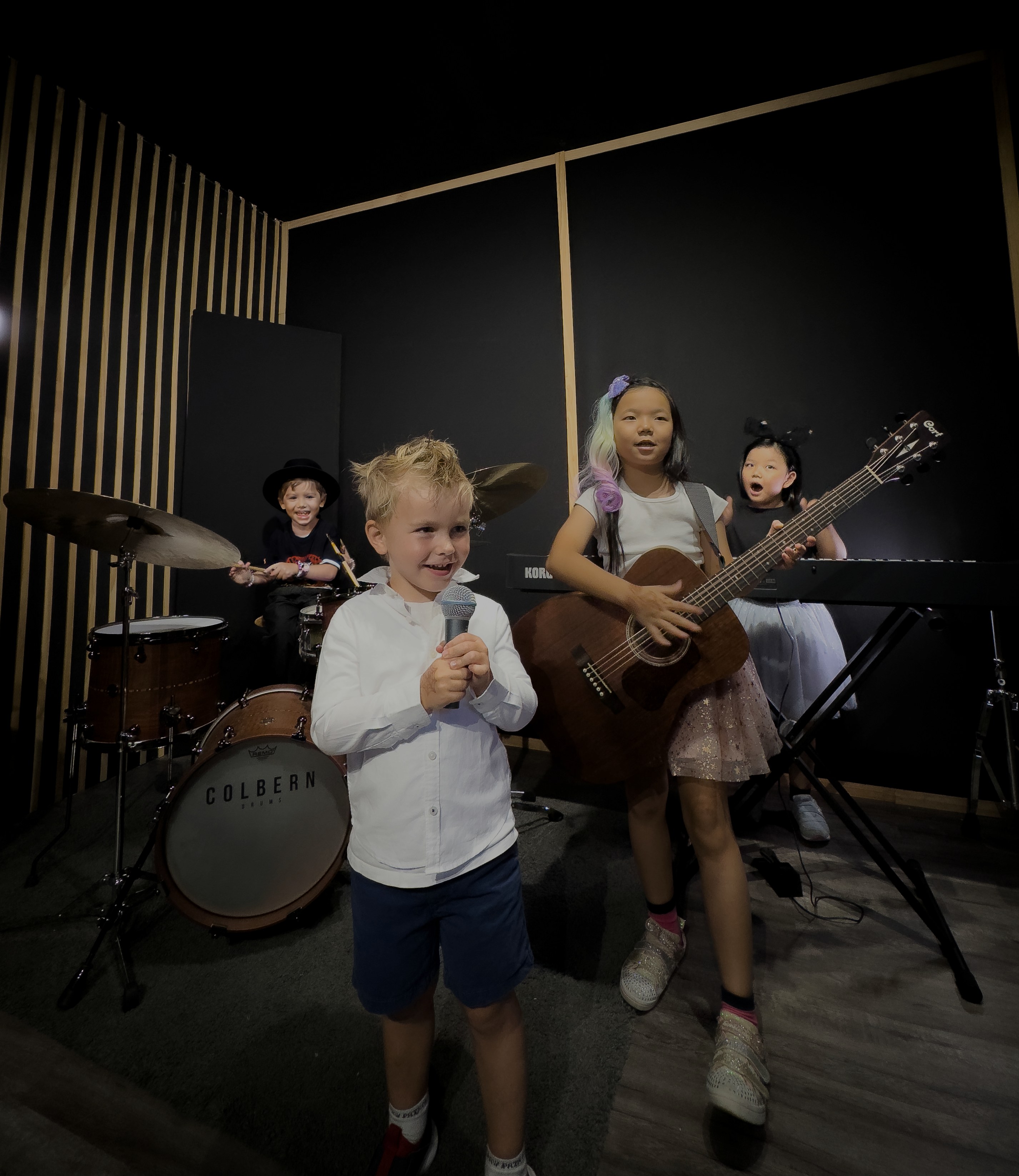 Kids performing together in a band