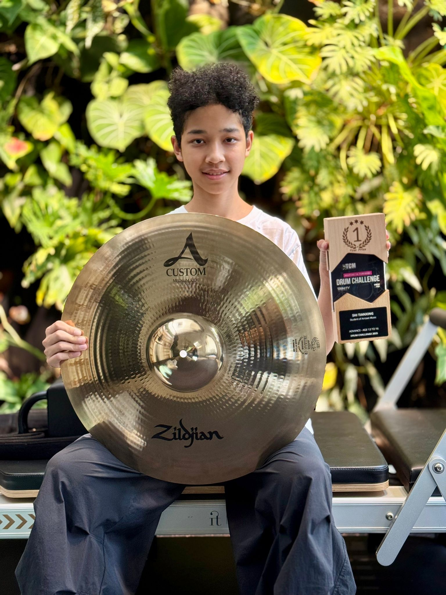 Shi Tianxing with 1st prize trophy and Zildjian cymbal